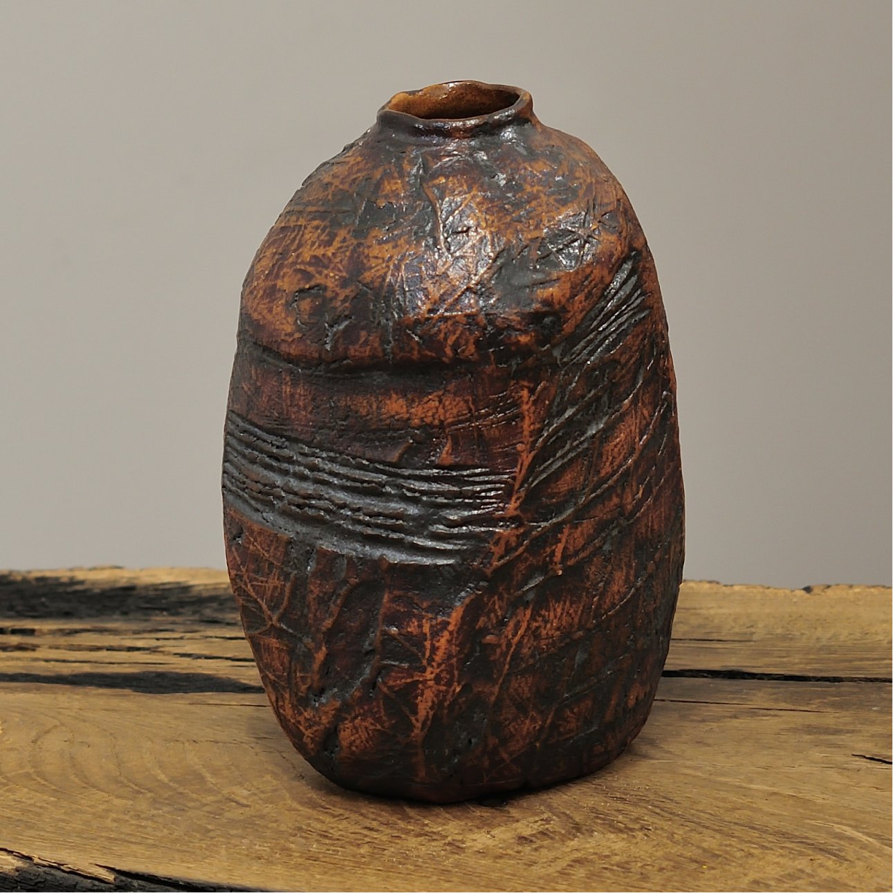 wabi sabi pottery on wooden surface