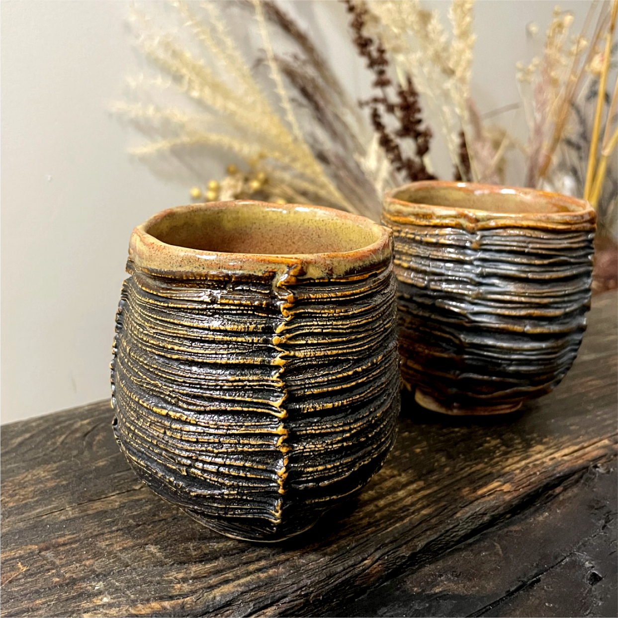 Stoneware yunomi cup with dune-inspired texture, handleless design