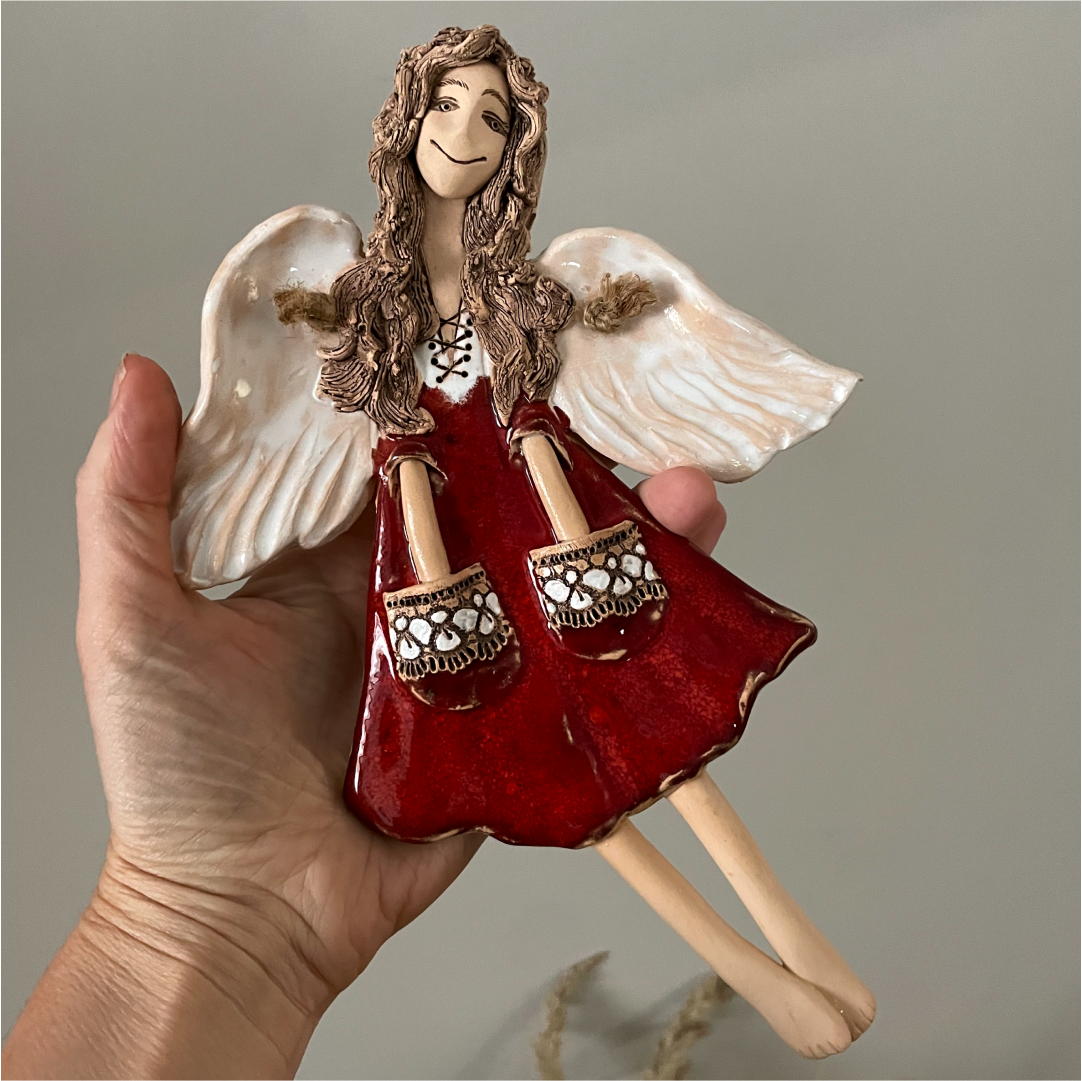 red ceramic angel wall hanging texture