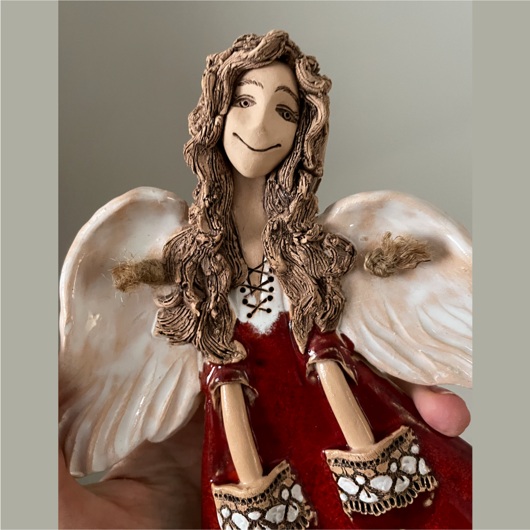 ceramic angel wall sculpture close up