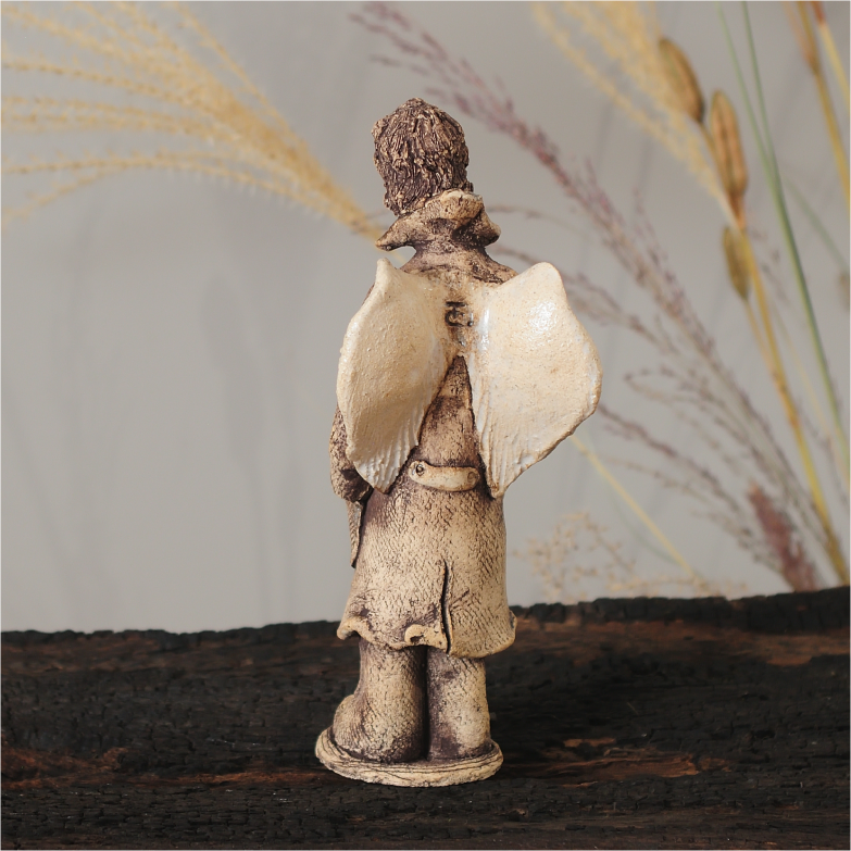 Ceramic angel sculpture, rear view