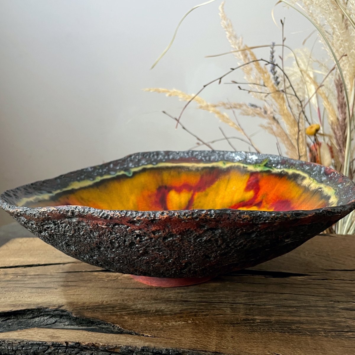 Handmade stoneware serving plate with textured exterior