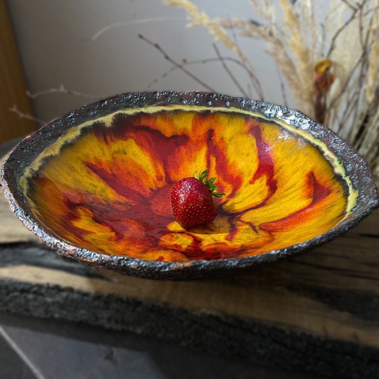 Large ceramic centerpiece plate with amber red crackle glaze