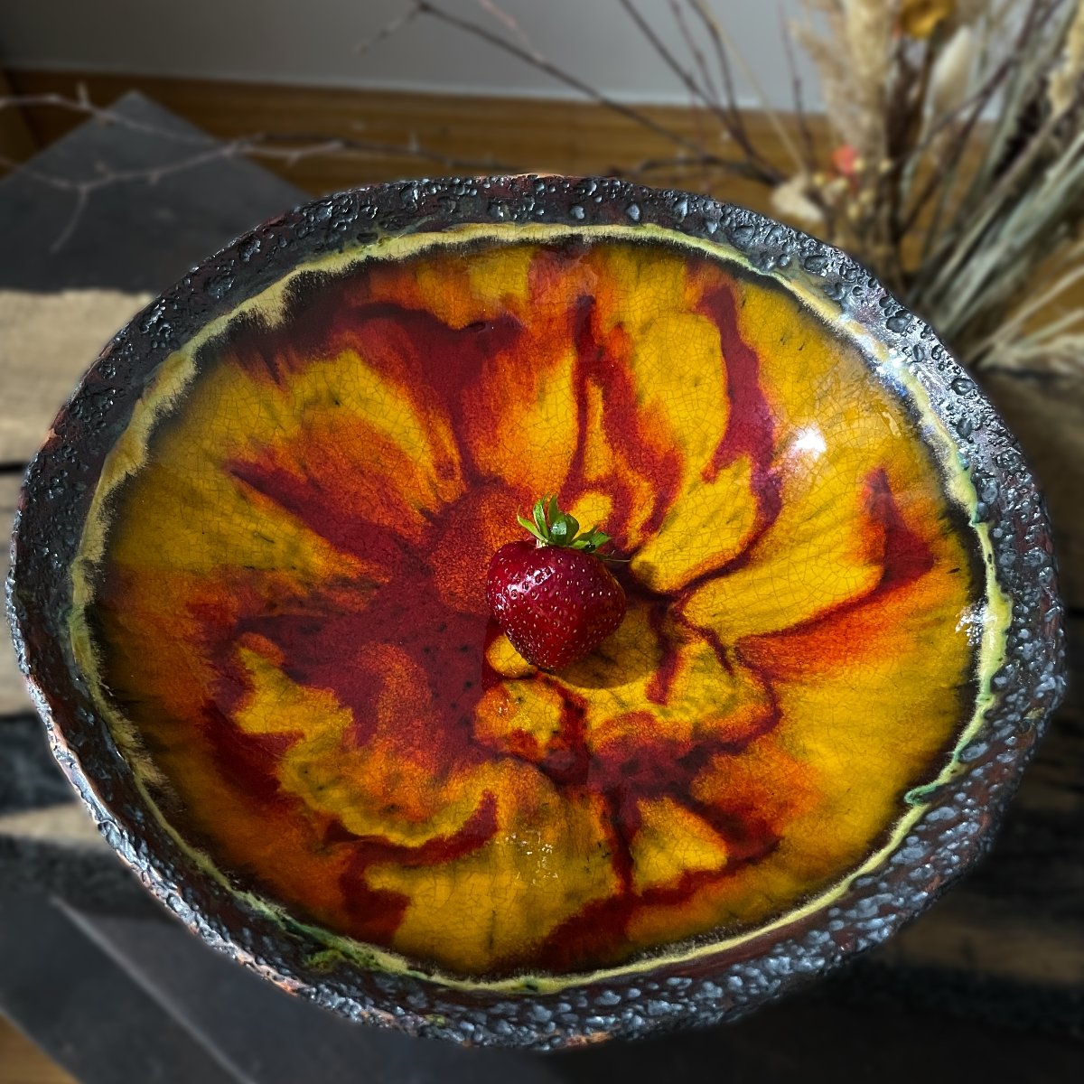 Handmade ceramic fruit plate with amber red crackle pattern