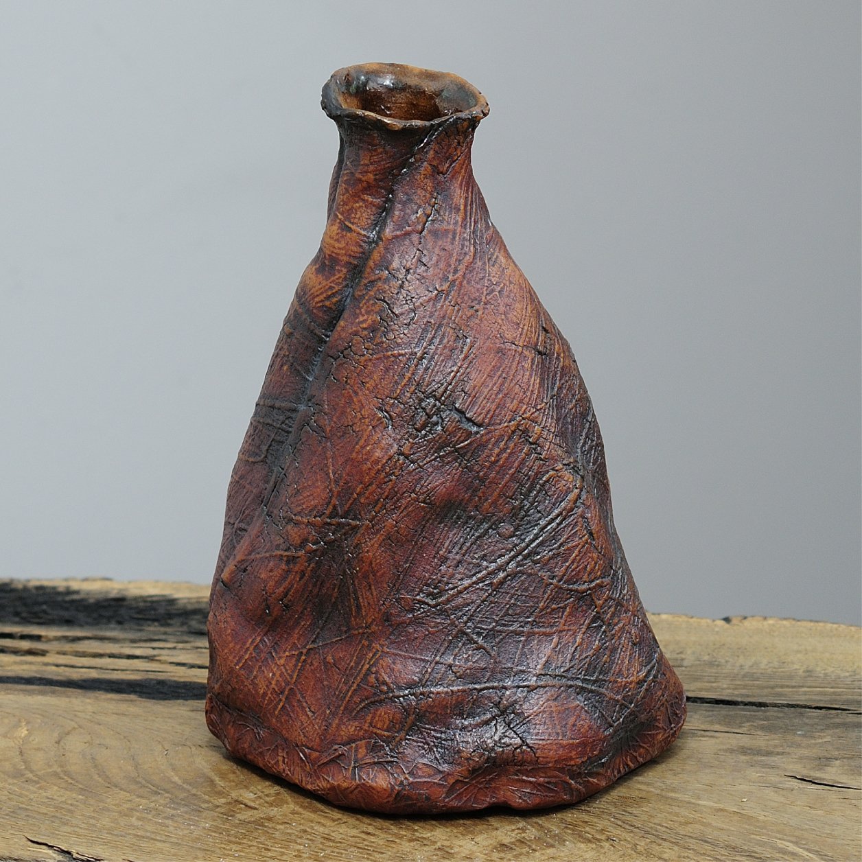 Side detail of textured organic vase surface