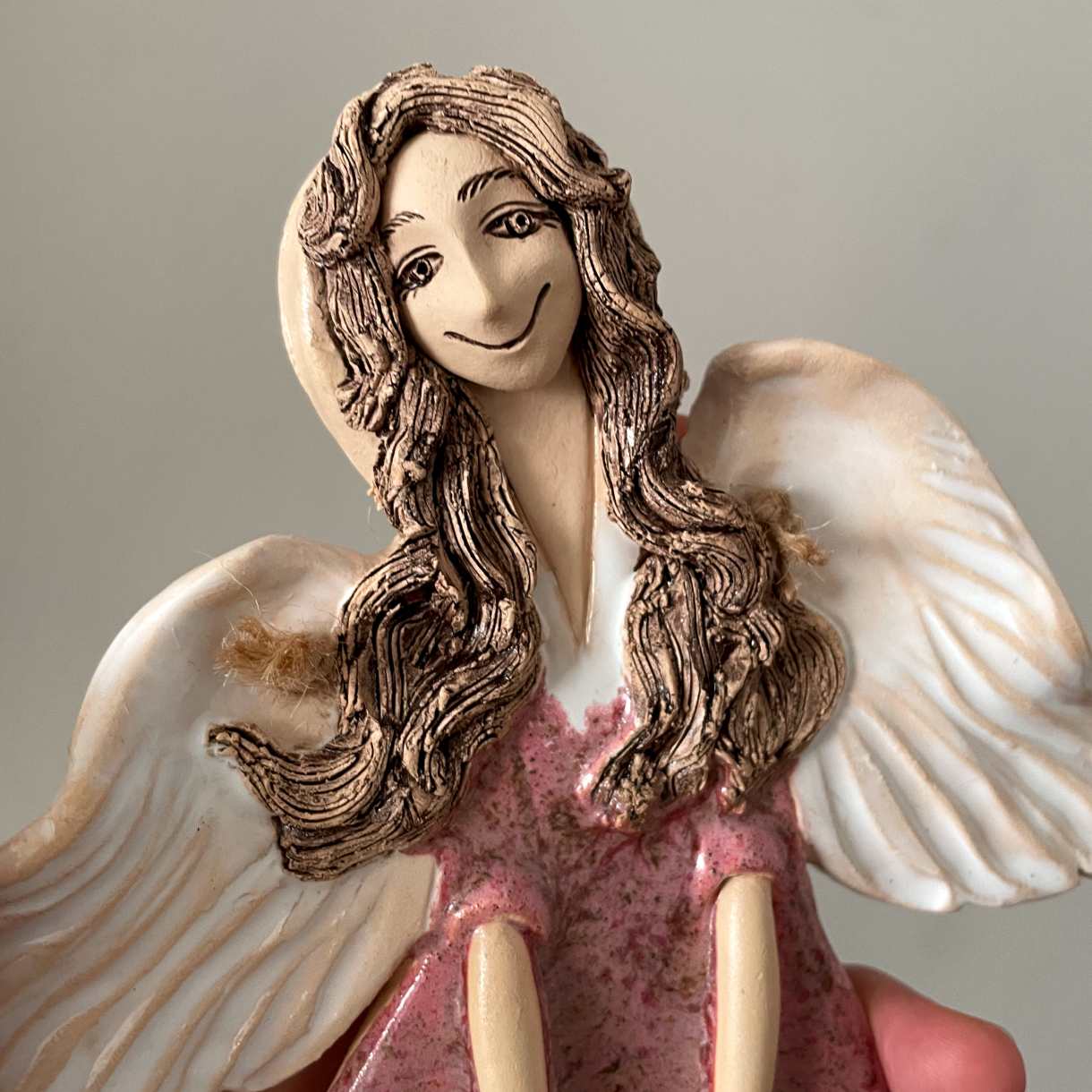 ceramic angel wall sculpture close up