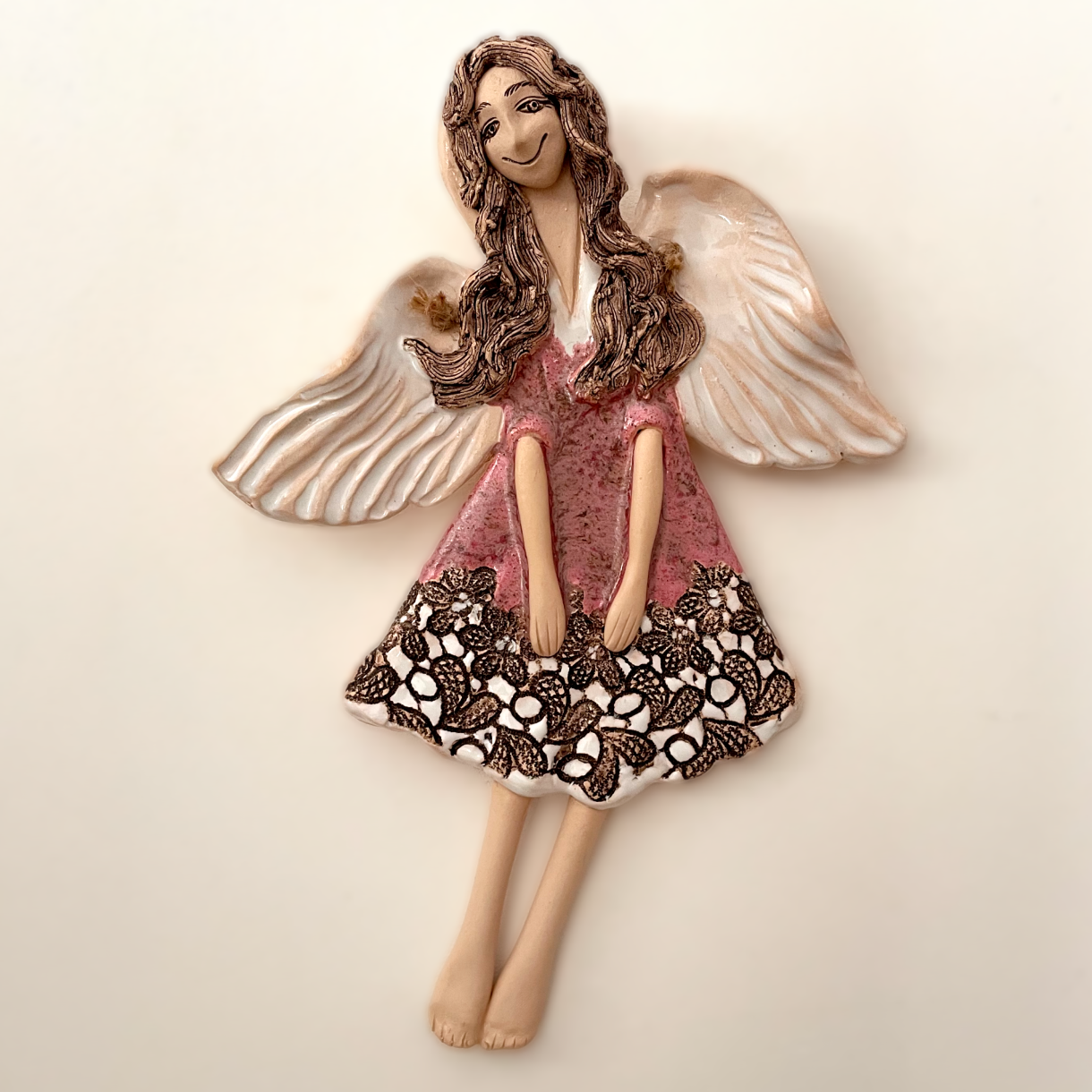 pink ceramic angel wall hanging texture