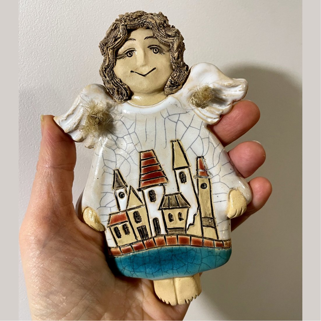 ceramic angel wall decor detail