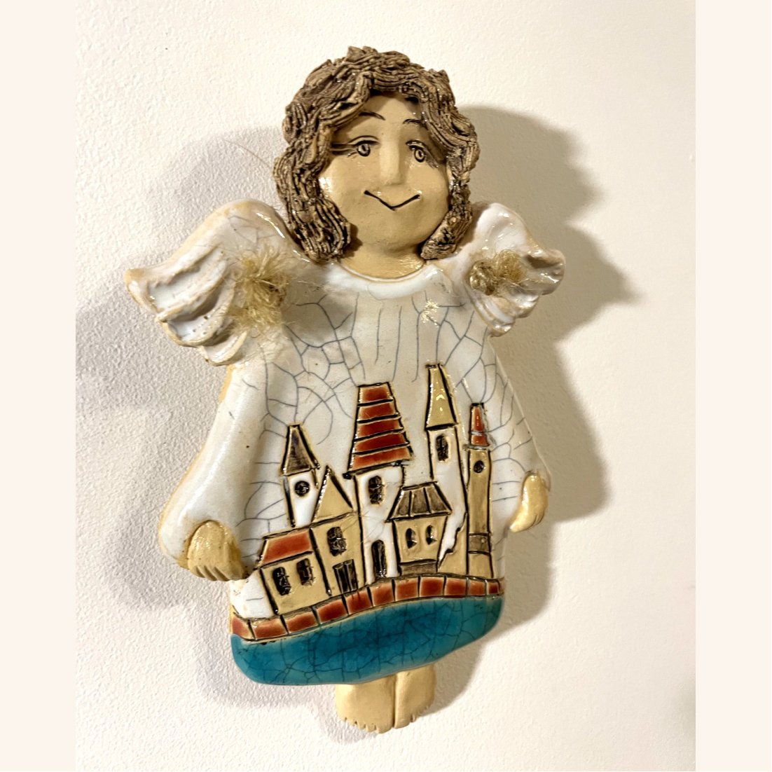 ceramic angel ornament with houses