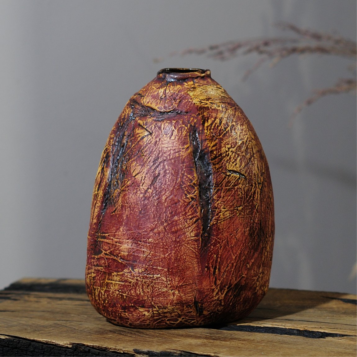 Handbuilt rustic ceramic vase with organic surface detail