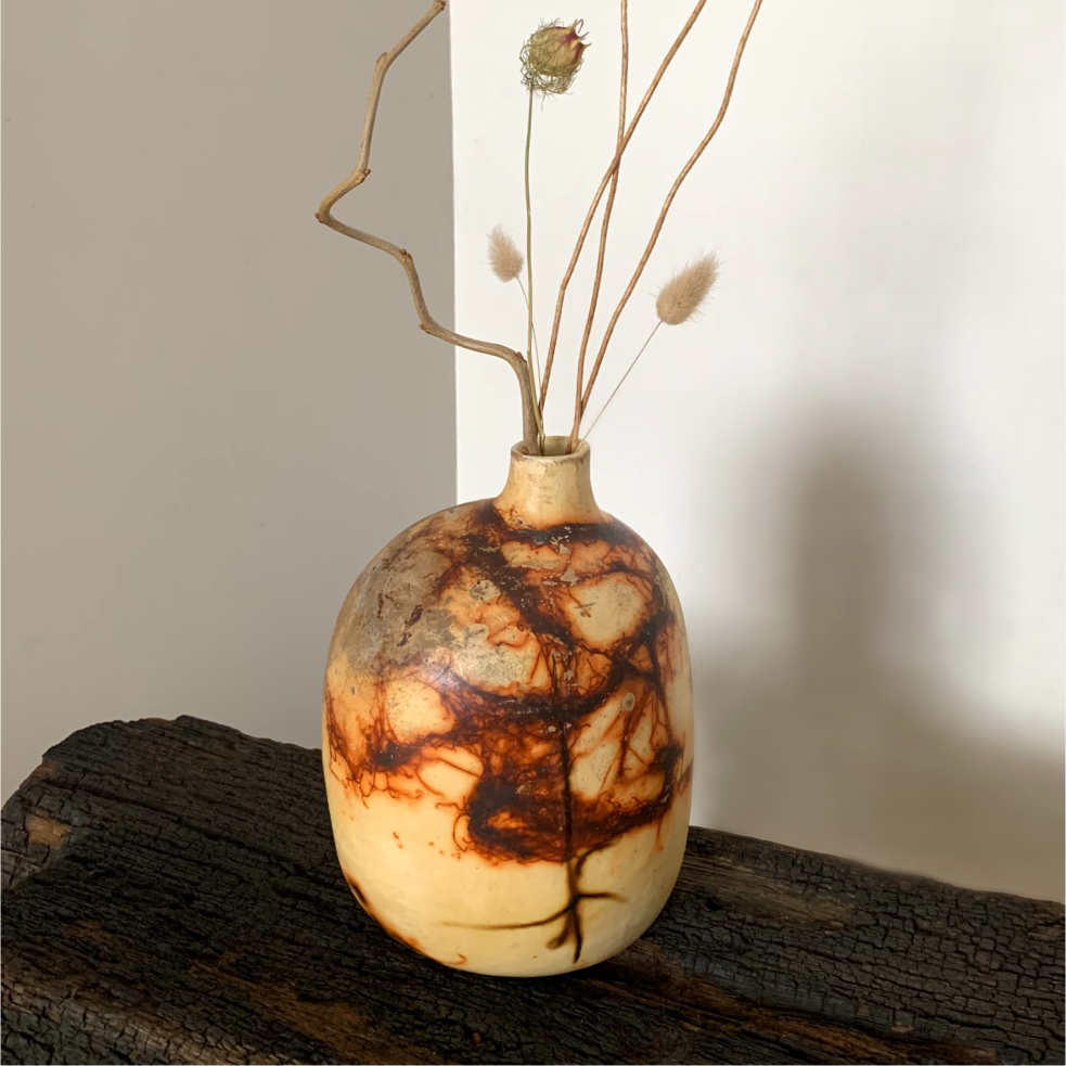 Organic textured ceramic vase with glazed interior and smoke marks