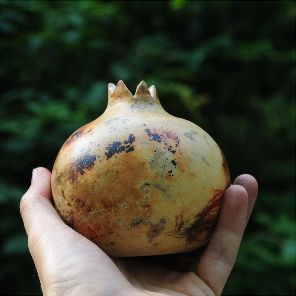 Saggar ceramic art object with symbol pomegranate pattern, close detailed view