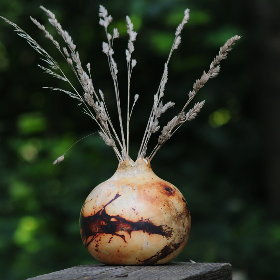 Artisan ceramic vase shaped as pomegranate with organic surface texture