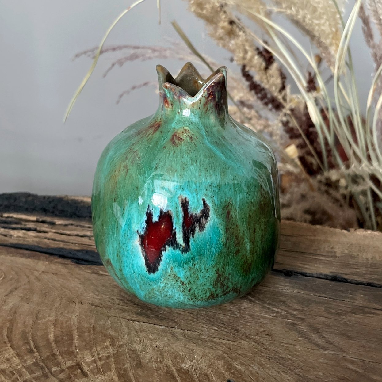 Handmade ceramic pomegranate sculpture in turquoise glaze