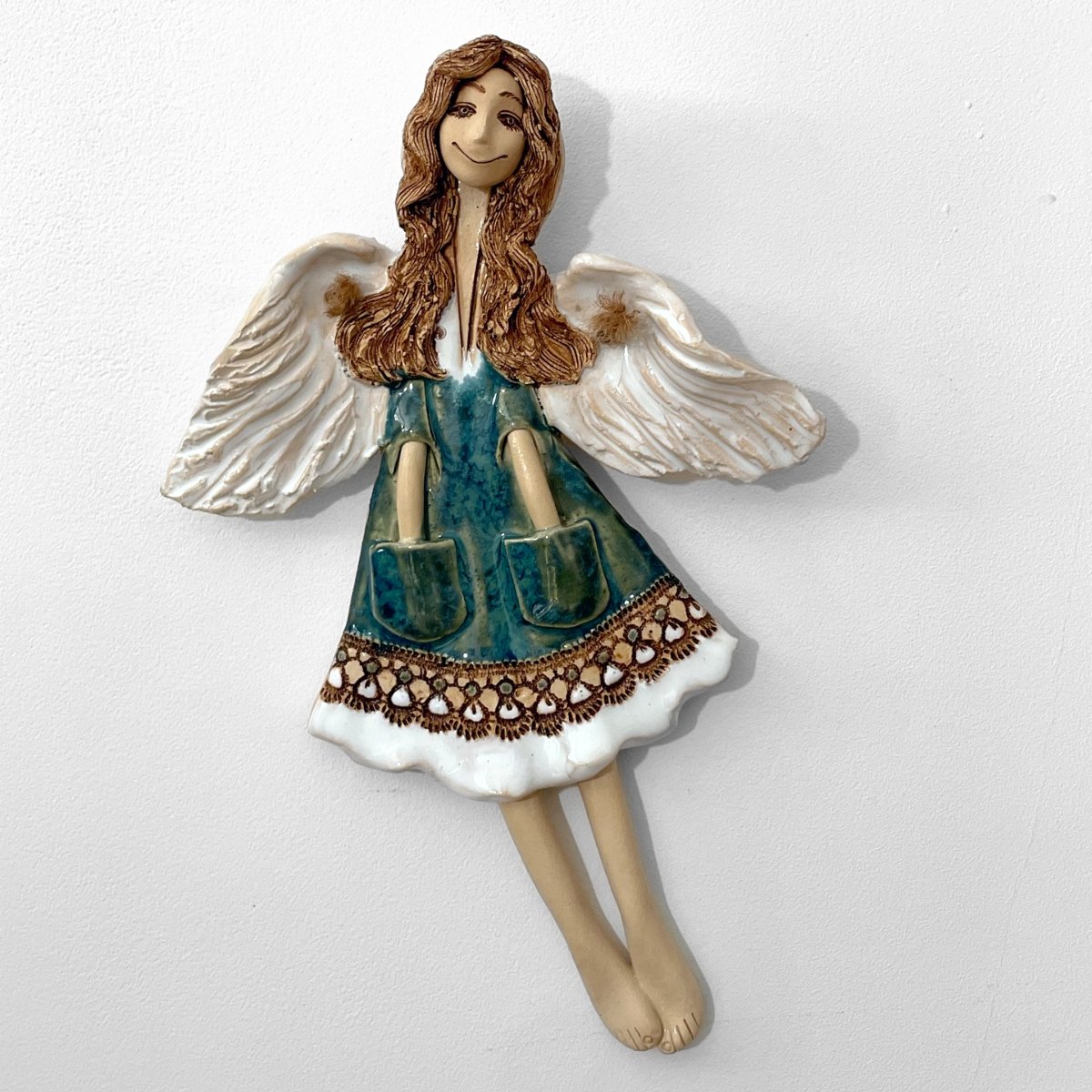 ceramic angel green with white wings wall-mounted