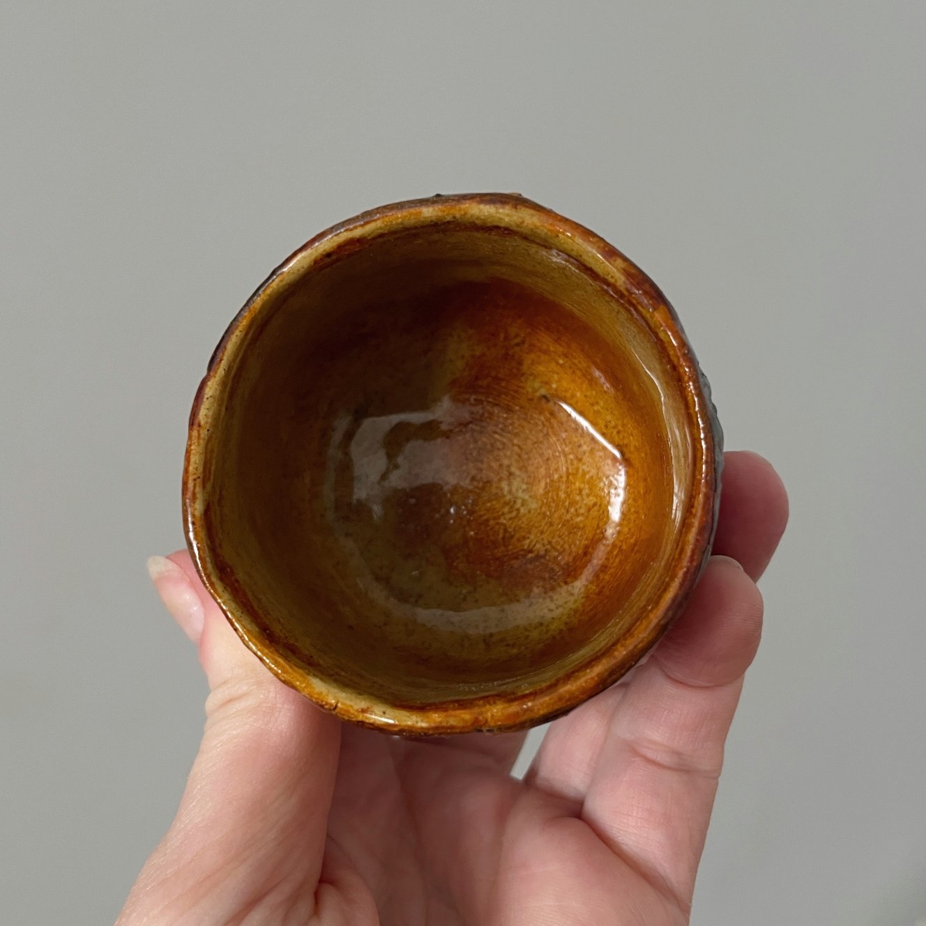 Top view of ceramic yunomi tea cup with glazed interior
