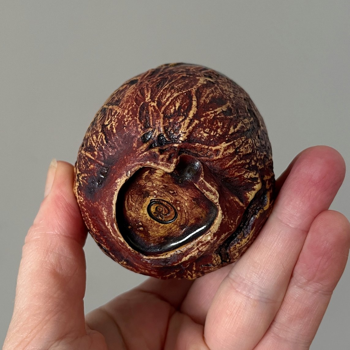 Bottom view of handmade pottery yunomi showing foot ring