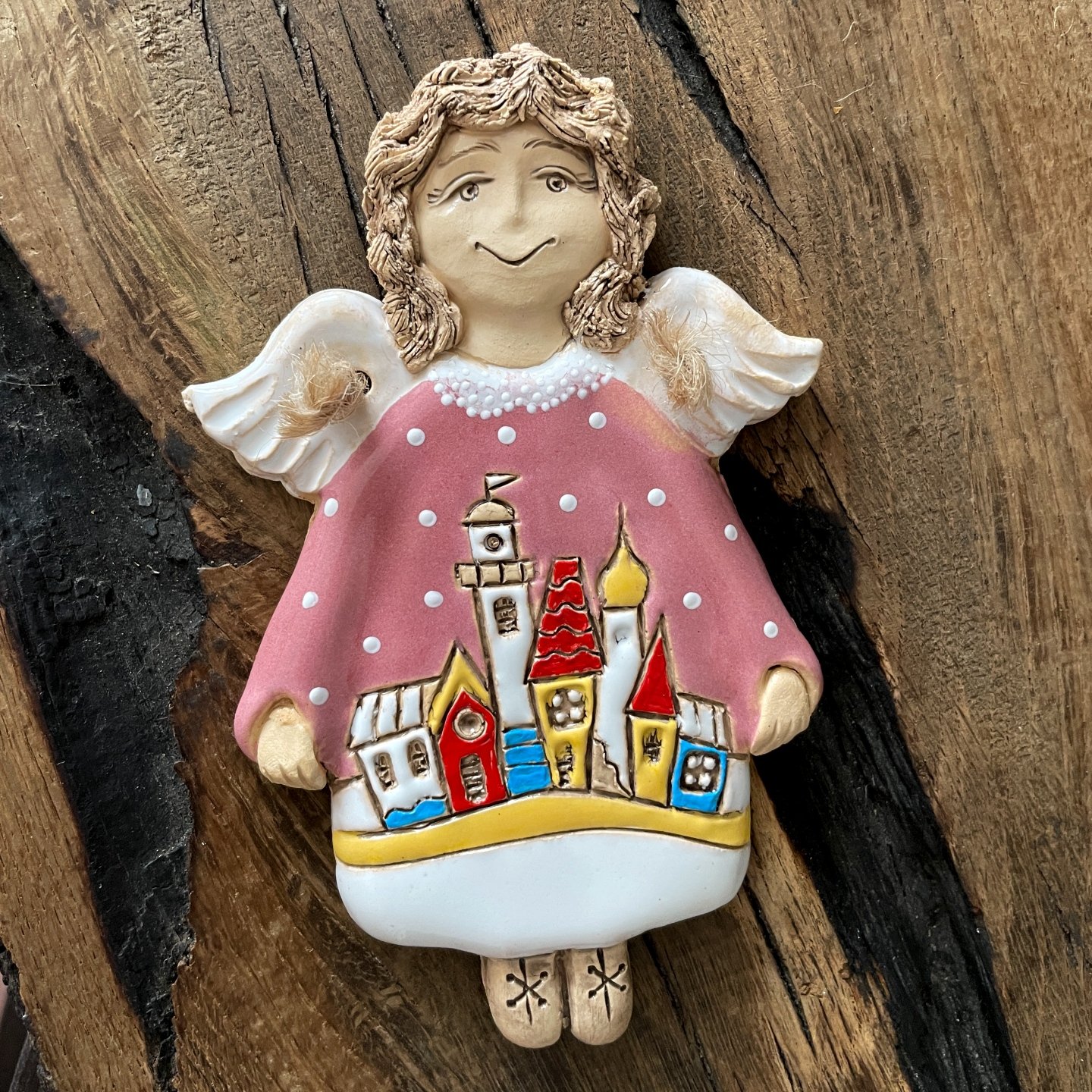 Pink ceramic angel wall hanging with miniature village