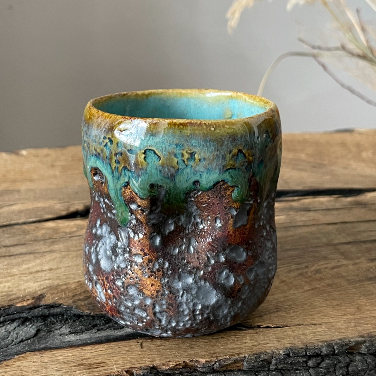 Side view of handcrafted clay coffee and tea cup