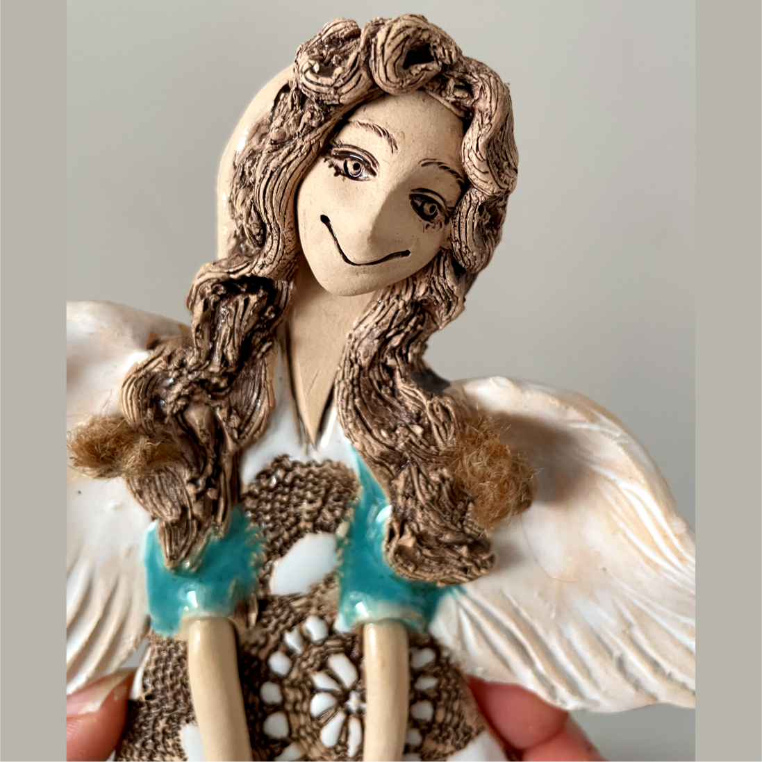 ceramic angel wall hanging detail