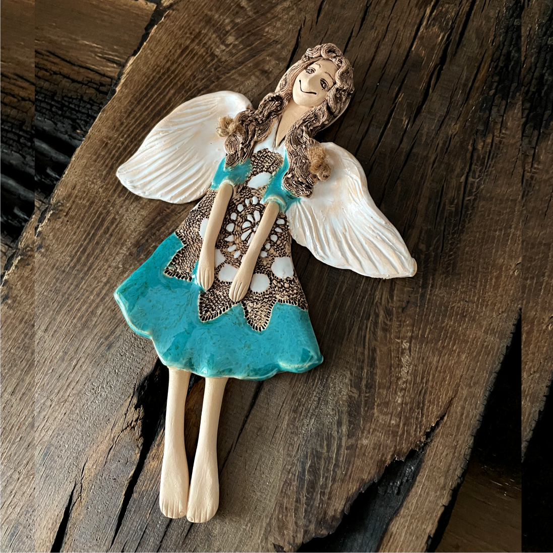 ceramic angel wall sculpture close up