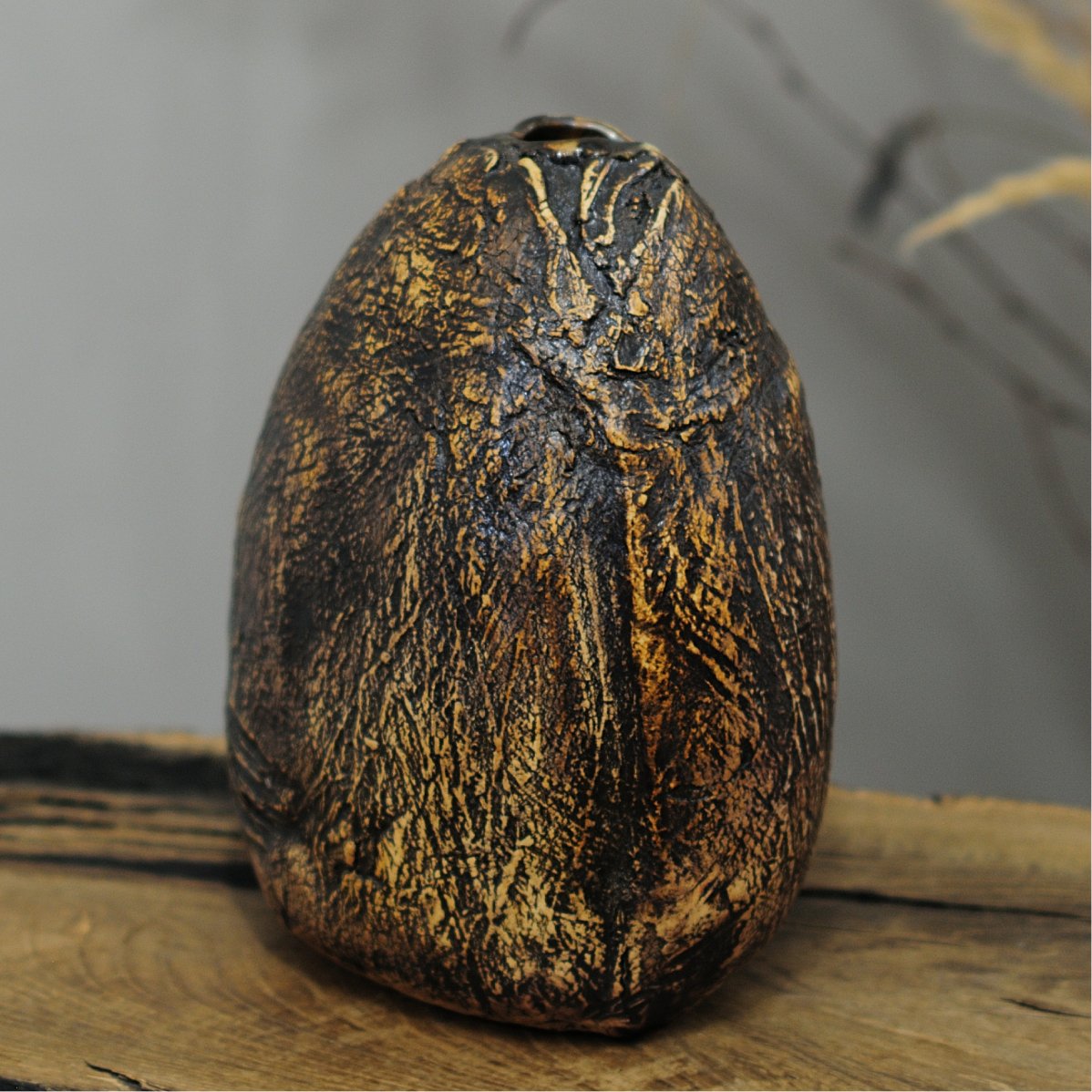 back view of textured ceramic vase