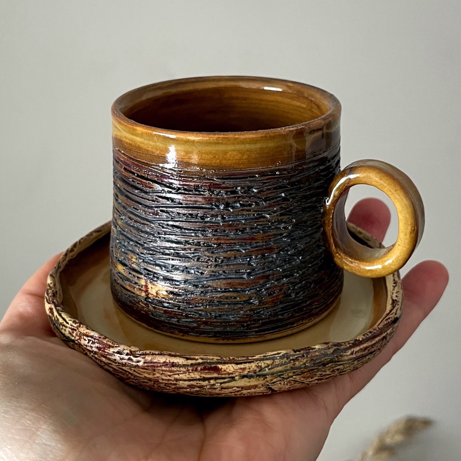 Handmade espresso cup and saucer set close-up