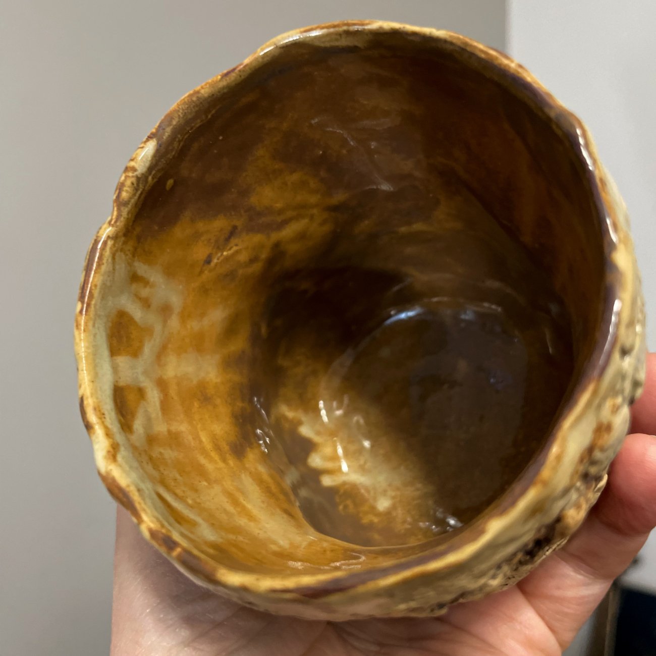 handmade pottery cup natural glaze detail