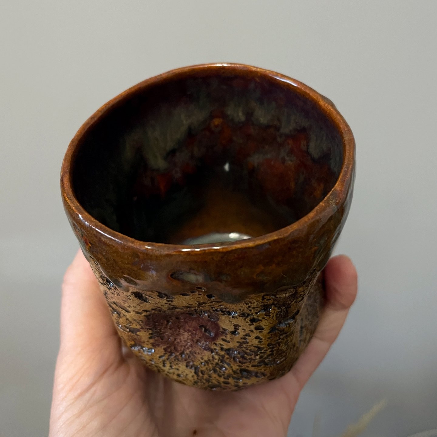 Stoneware tea cup handmade from clay with textured pottery finish