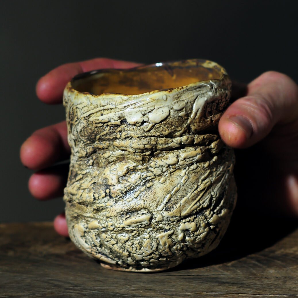 handmade ceramic cup close up texture