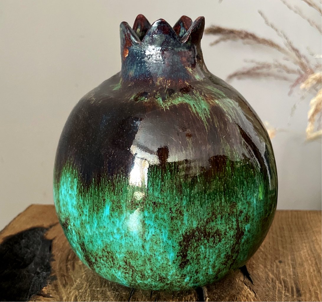 Ceramic pomegranate vase with dark green glaze