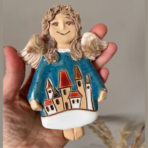 ceramic angel wall decor with houses front view