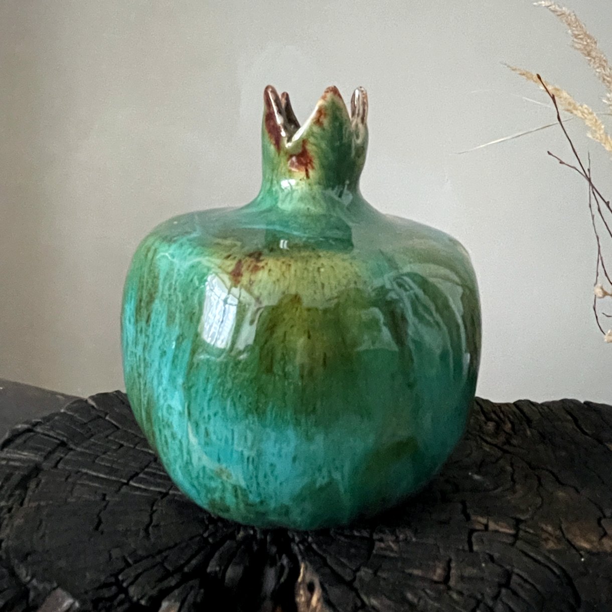 Handmade ceramic pomegranate sculpture with green glossy glaze