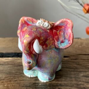 Hand-painted glazed clay elephant figurine representing contemporary whimsical pottery art