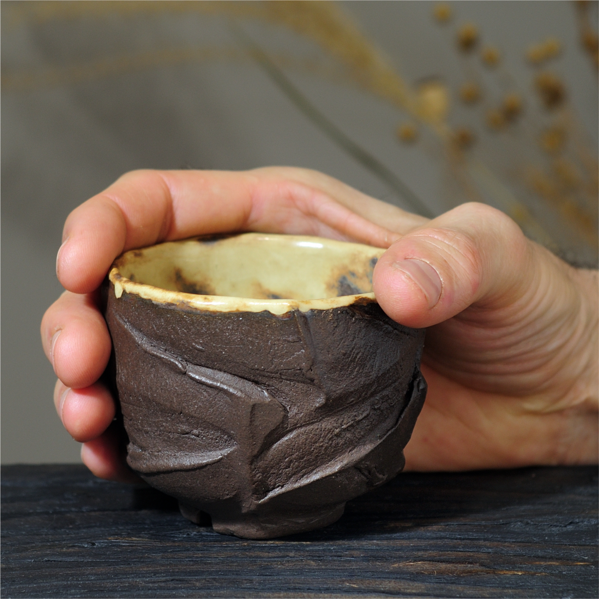 Hand-carved yunomi cup with textured surface, handleless design