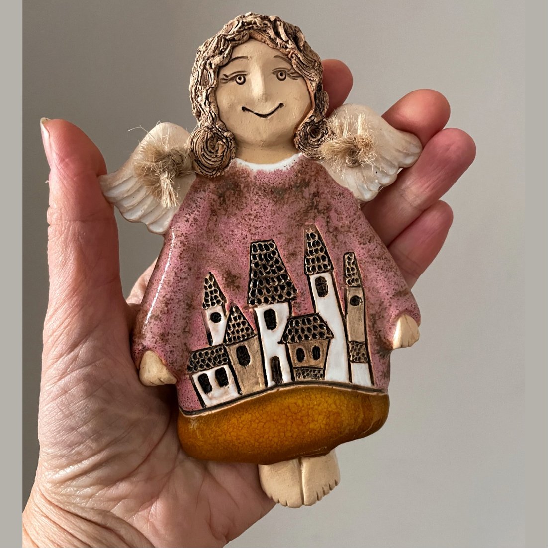 small ceramic angel wall hanging detail