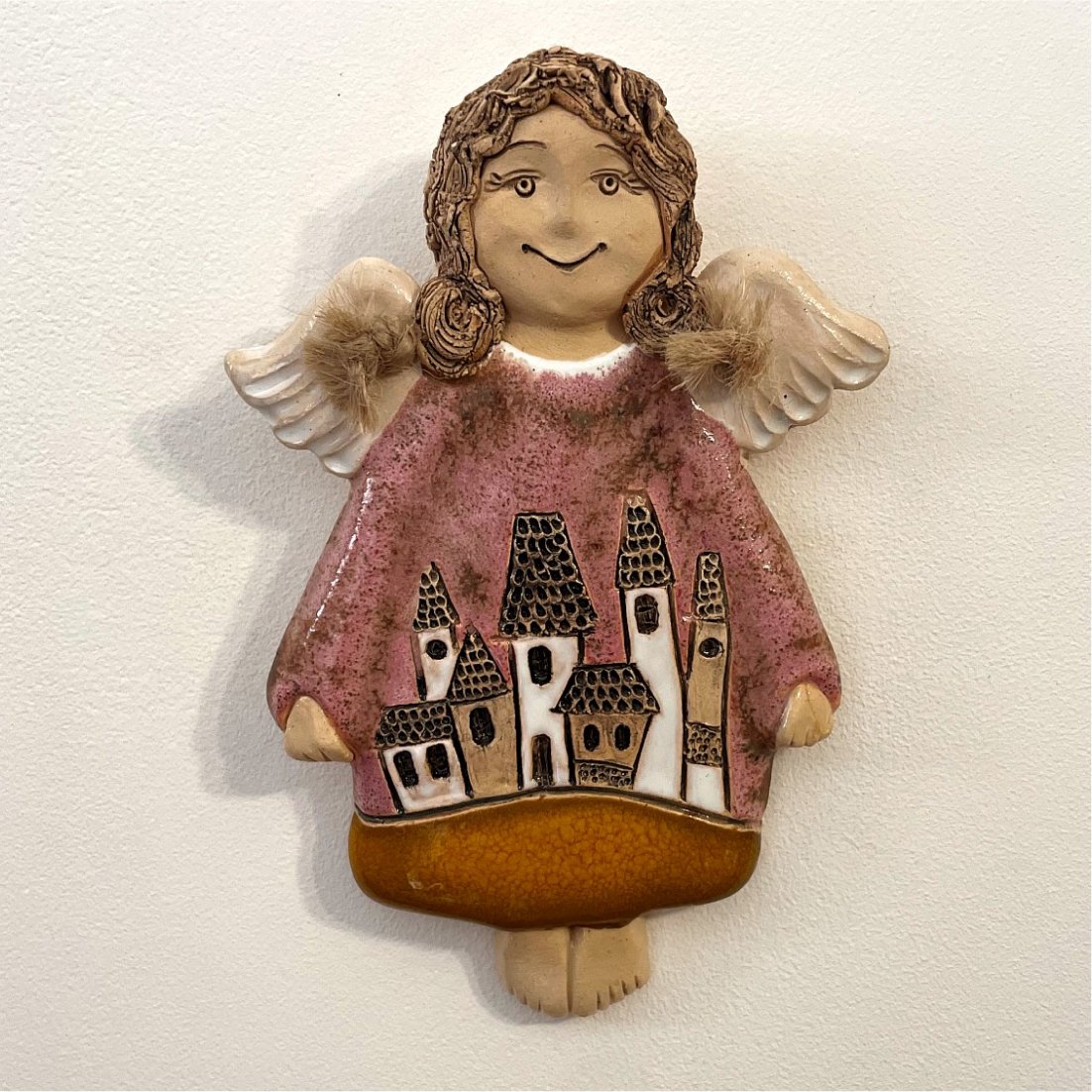 handmade ceramic wall angel with house motif