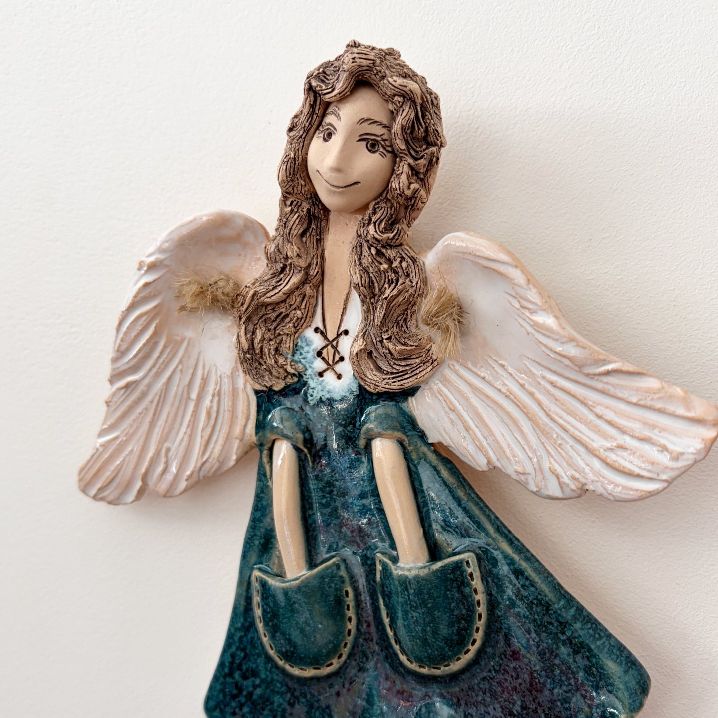 Handmade ceramic angel wall hanging, full front view
