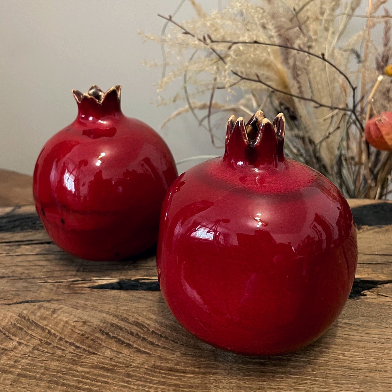 handmade ceramic pomegranate vase with dry branches, red pottery fruit vase