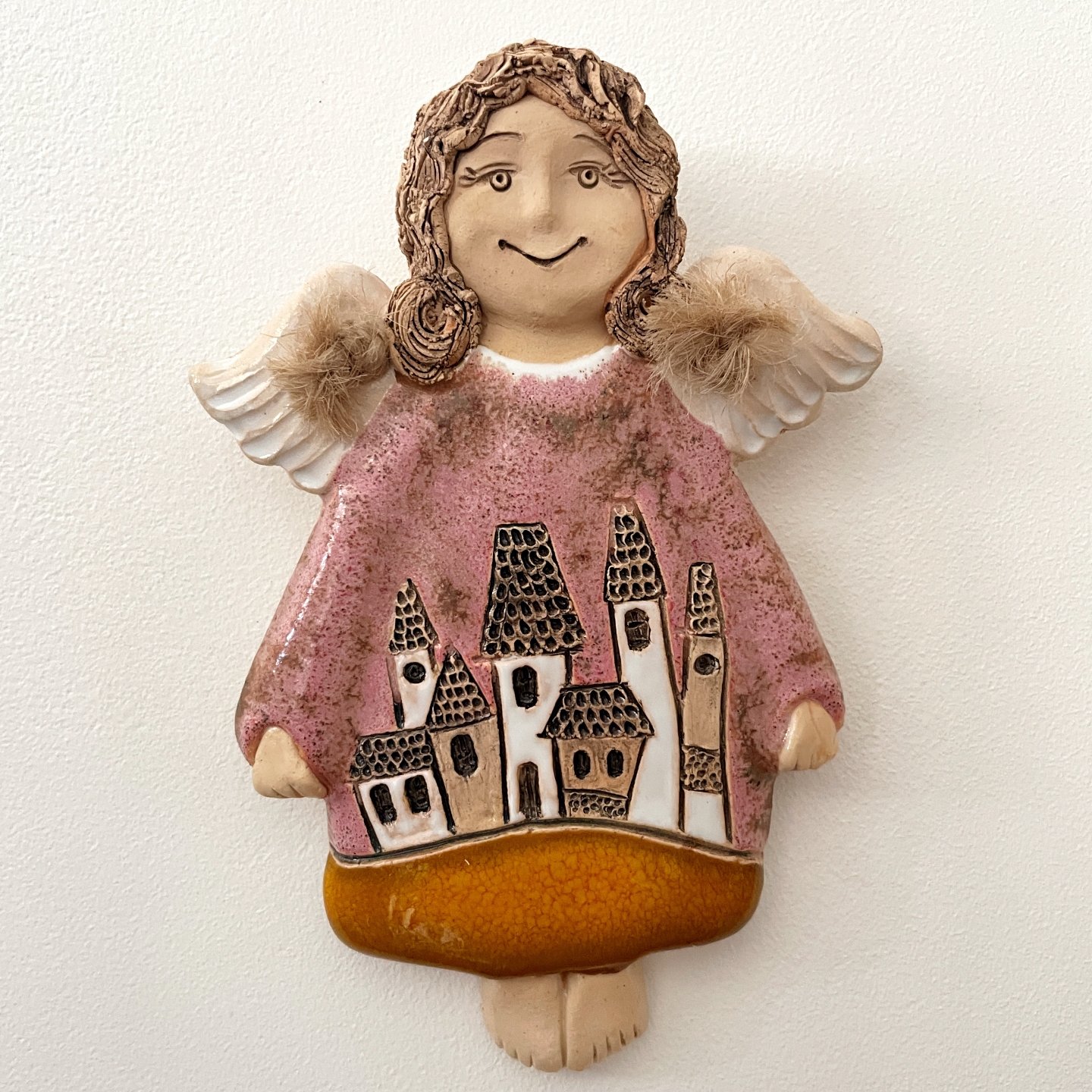 ceramic wall hanging angel with houses front view