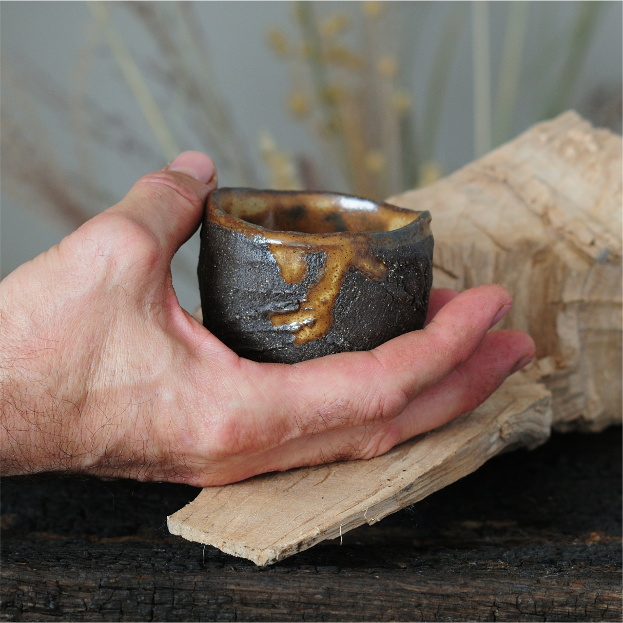 Kurinuki ceramic yunomi tea cup, side view, black clay