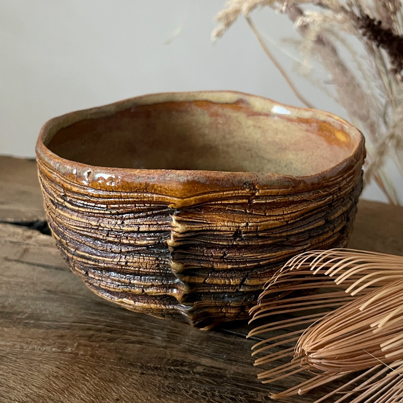 Side view of handmade stoneware chawan for matcha tea