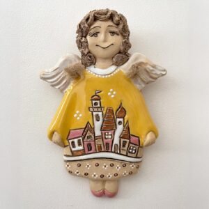 Decorative ceramic angel wall hanging with village illustration
