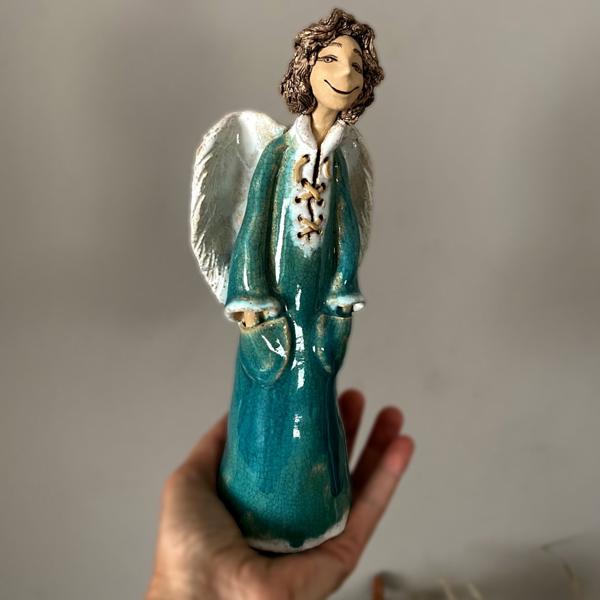 Handmade ceramic angel figurine, sculptural detail