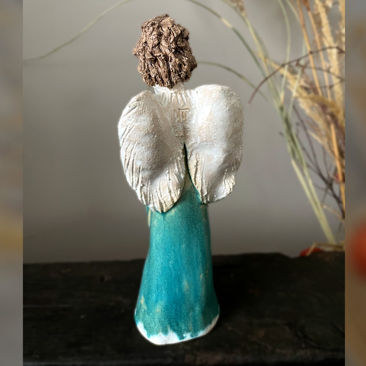 Ceramic angel sculpture, back view