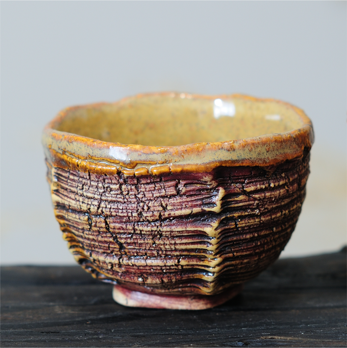 Handmade tea bowl with textured surface, stoneware ceramic