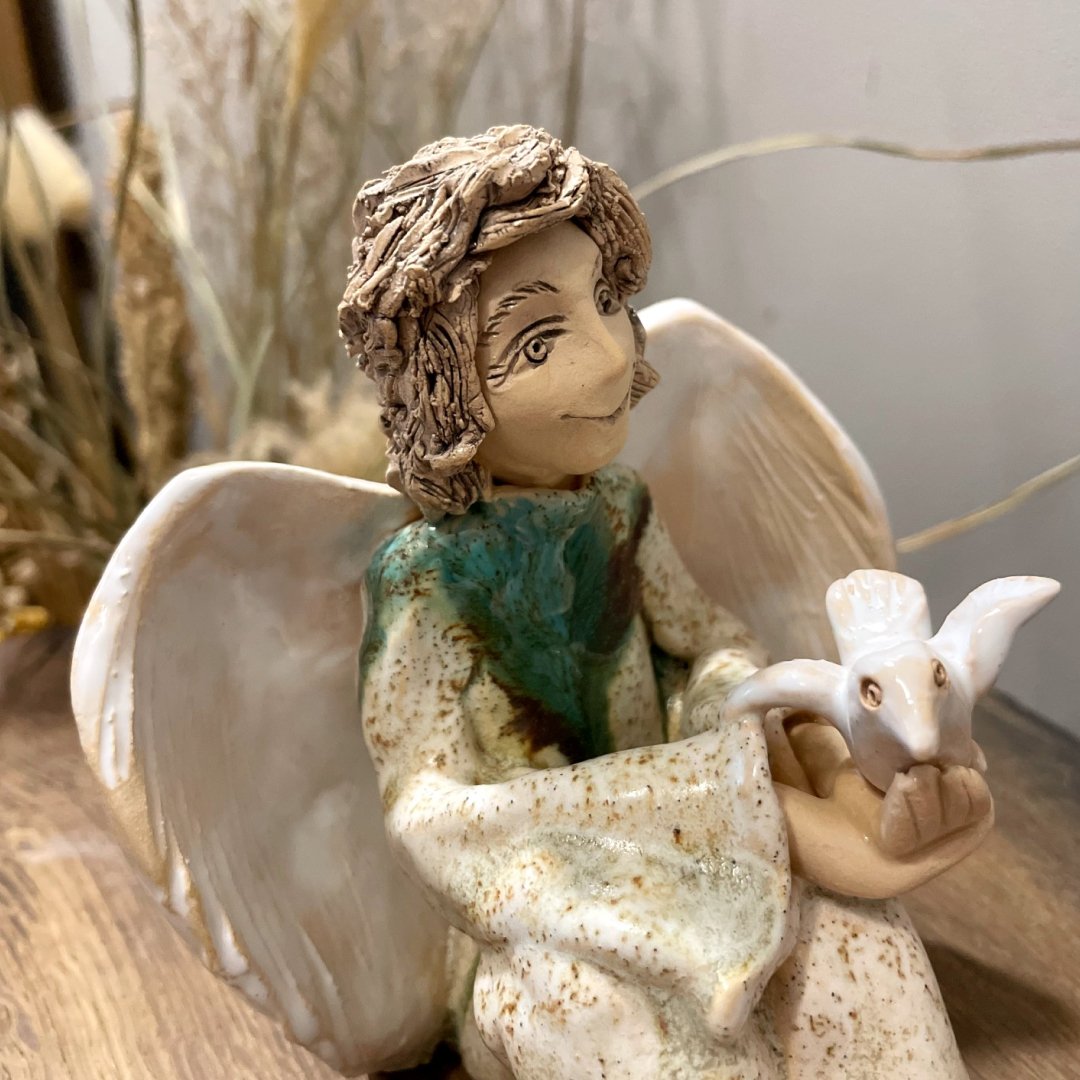 handmade clay angel figurine close up