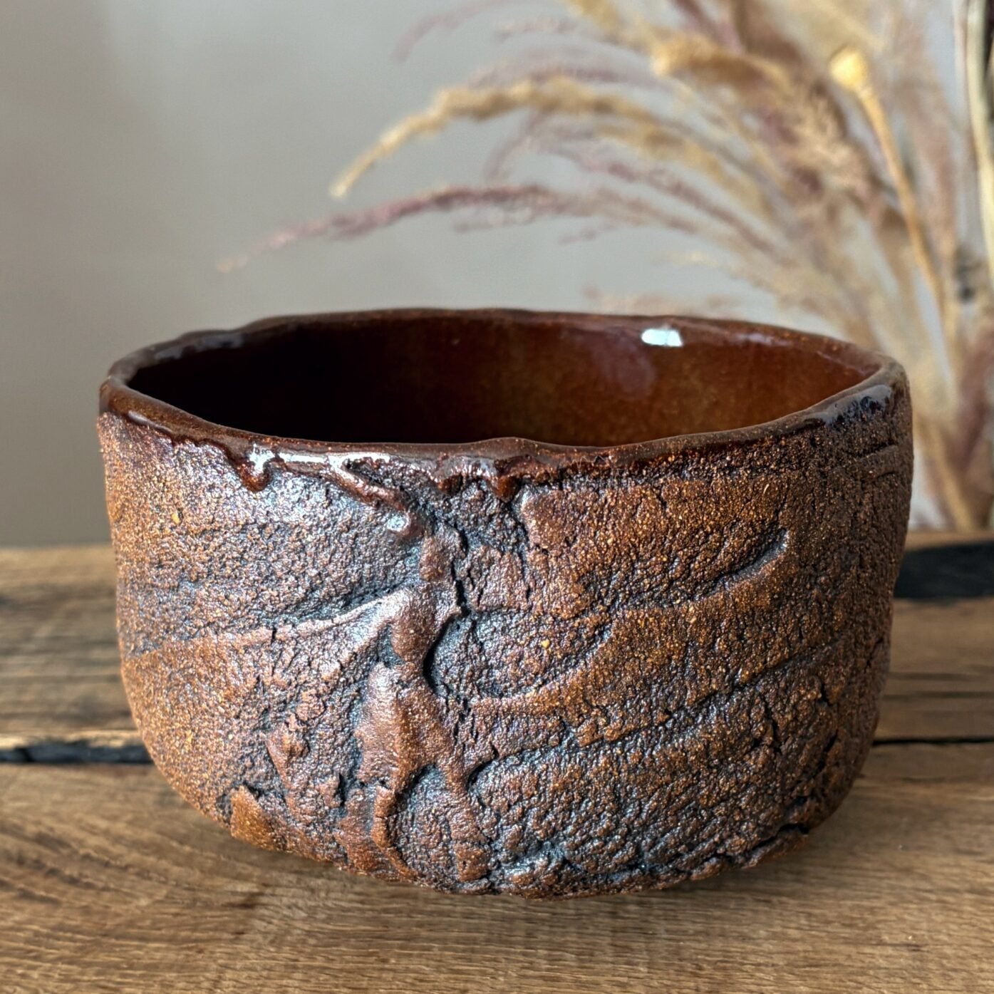 Handmade ceramic tea bowl with Kurinuki textured exterior