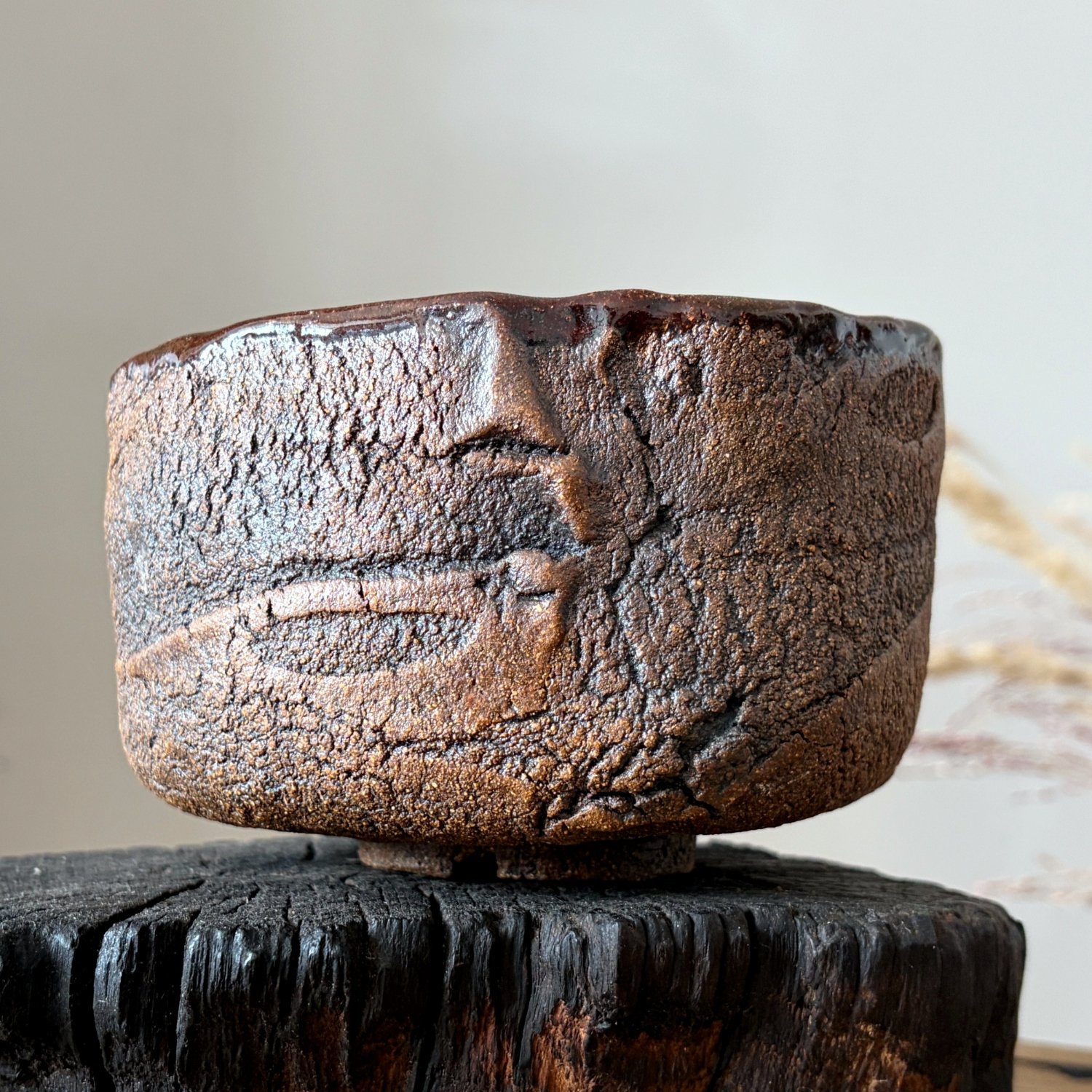 Rustic pottery bowl featuring hand carved texture and natural clay tones