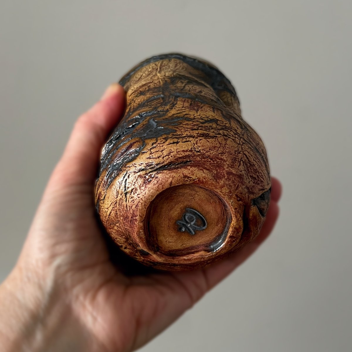 Bottom view of handmade ceramic tea cup with foot ring